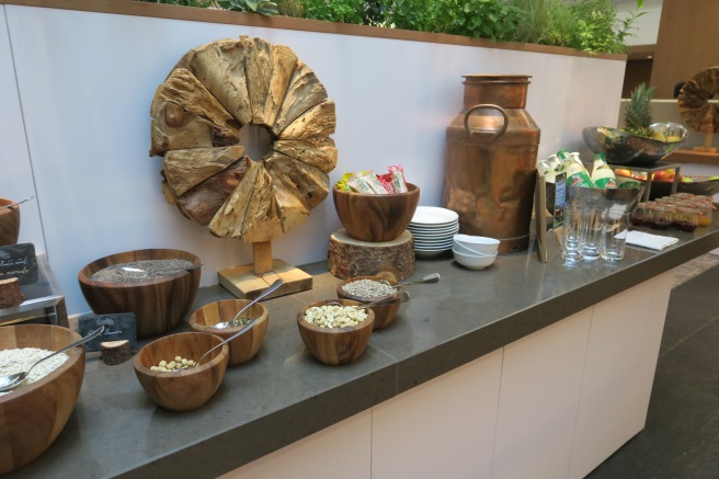 a counter with bowls and bowls of food