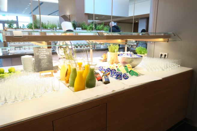 a buffet table with drinks and glasses