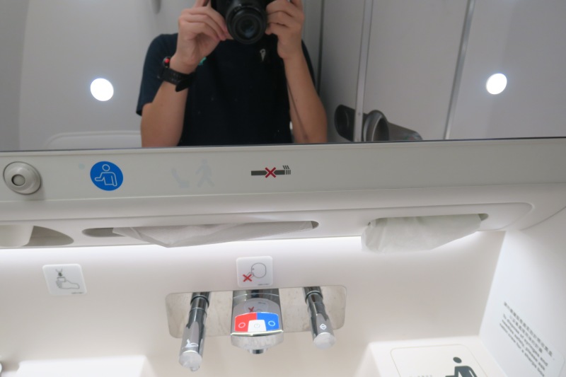 a person taking a selfie in a bathroom