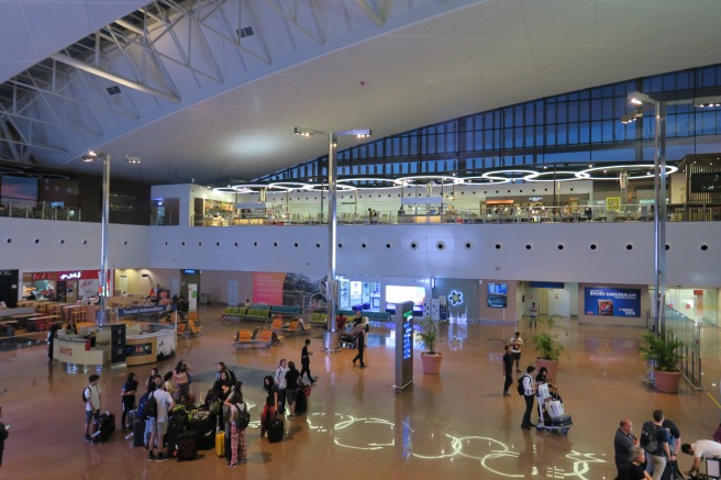 a group of people in a large airport