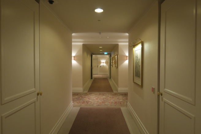 a hallway with a carpeted floor