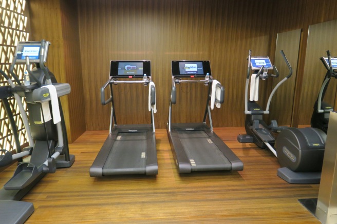 a group of treadmills in a room