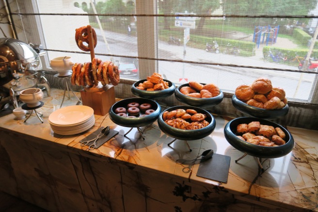 a buffet table full of pastries