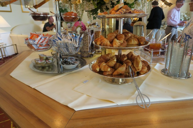 a tray of croissants on a table