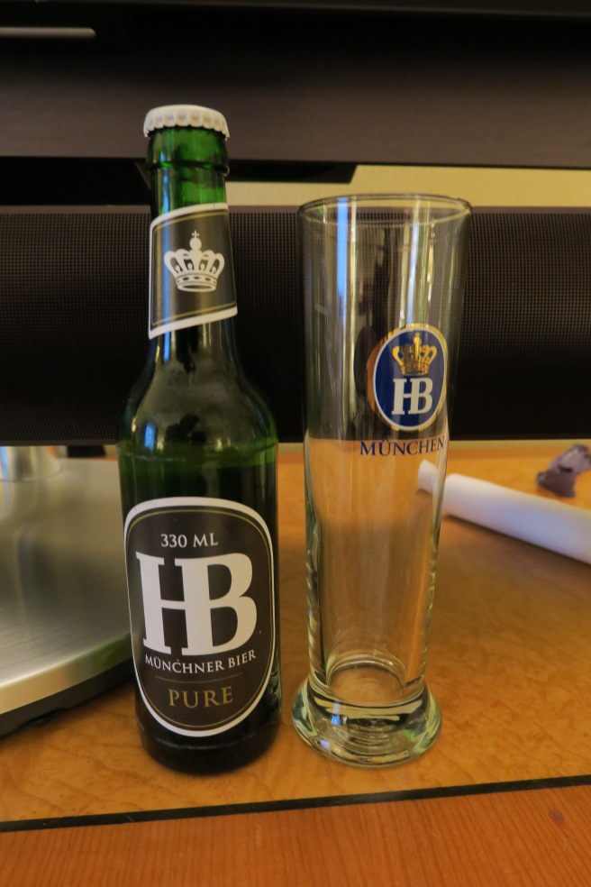 a bottle and glass on a table