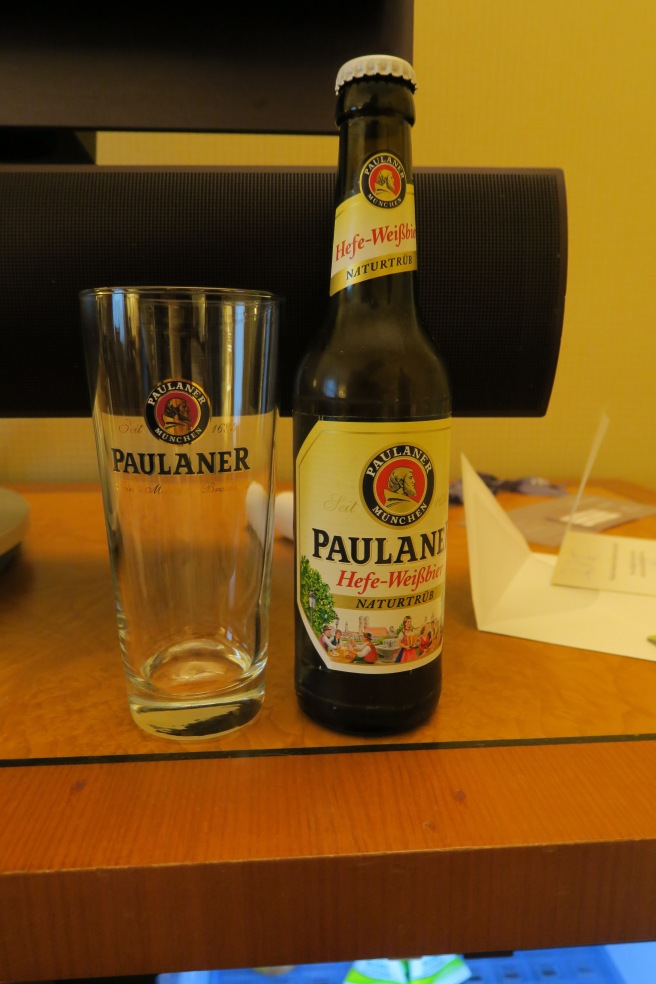 a bottle and glass on a table