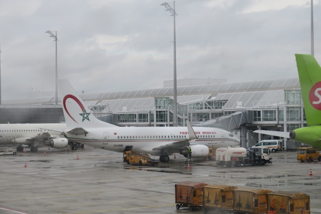 a large white airplane parked at an airport