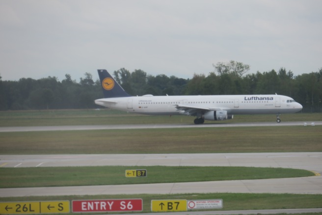 a white airplane on a runway