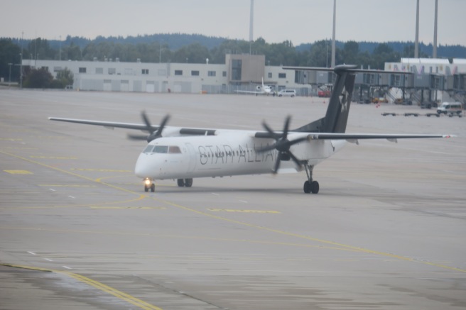 a white airplane on a runway