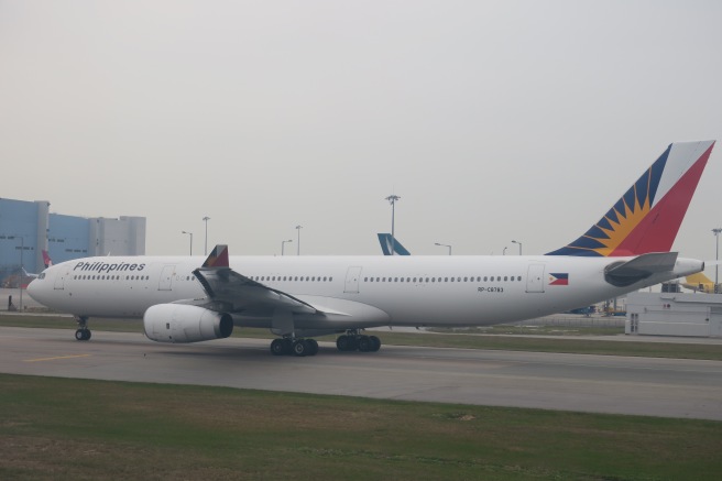 a large white airplane on a runway