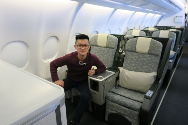 a man sitting on an airplane seat