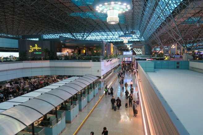 a group of people walking in a terminal