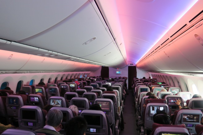 a group of people sitting in an airplane