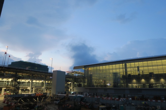 a building with glass walls and a blue sky