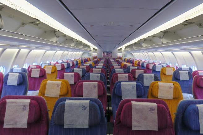 rows of colorful seats on an airplane