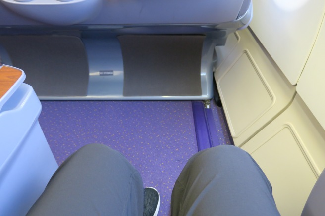 a person's legs in a seat