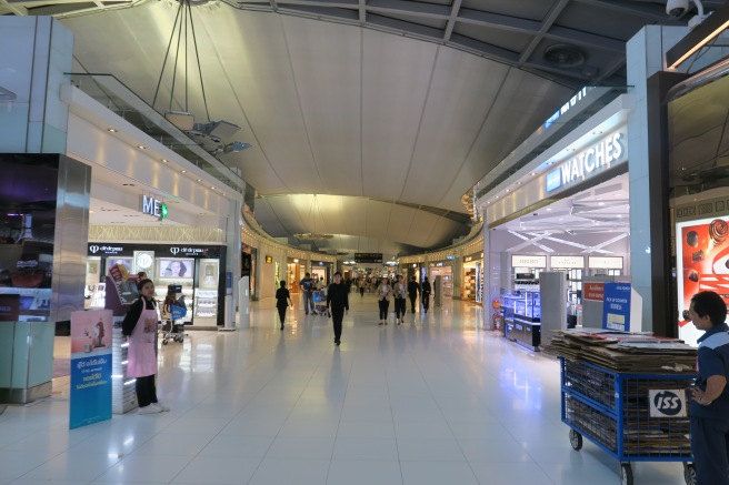 a group of people walking in a mall