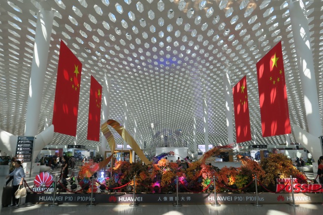 a large white ceiling with red flags