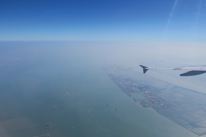 an airplane wing above water