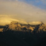 a mountain range with clouds