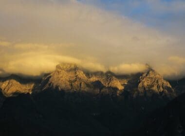 a mountain range with clouds