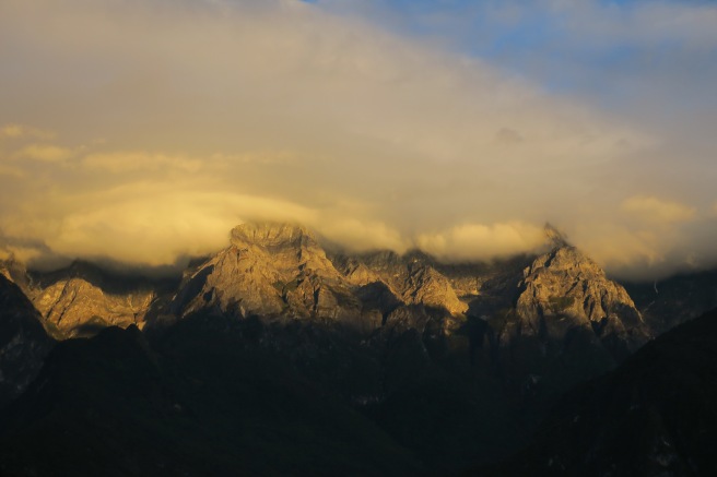 a mountain range with clouds