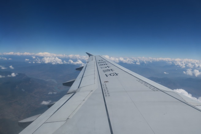 an airplane wing in the sky