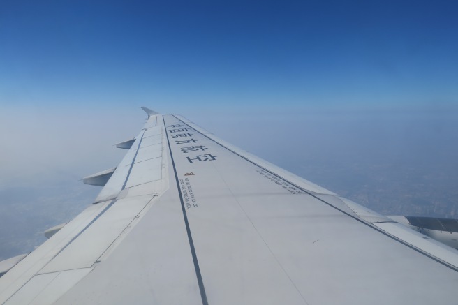 an airplane wing in the sky