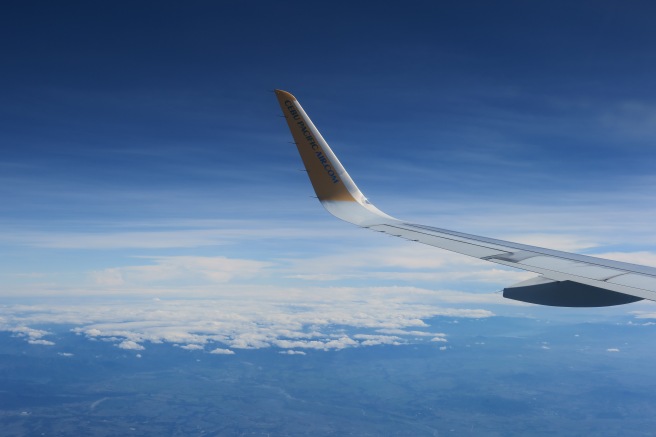 an airplane wing in the sky