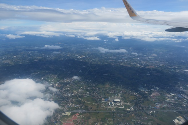 an aerial view of a city and clouds