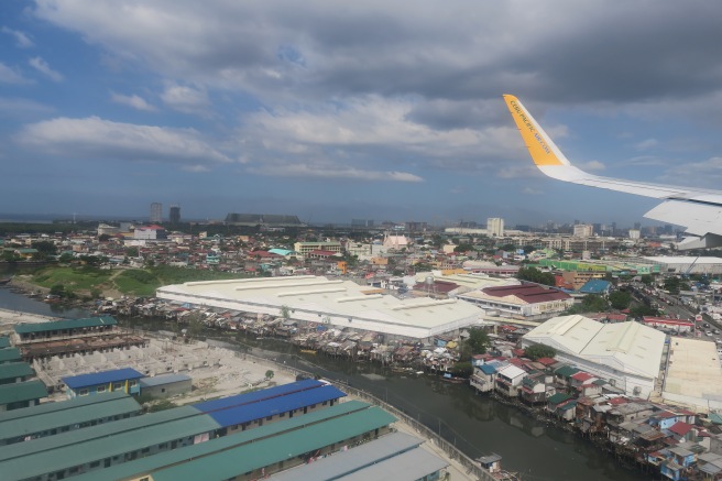 an airplane flying over a city