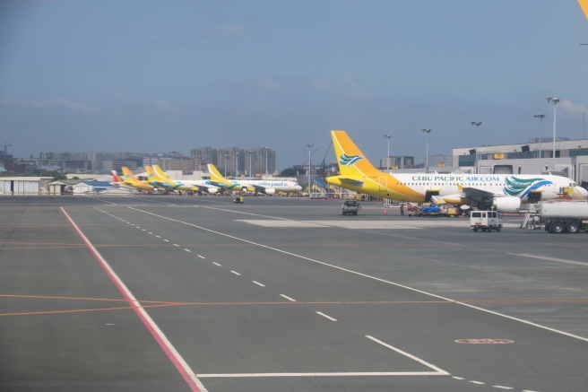 a group of airplanes on a runway