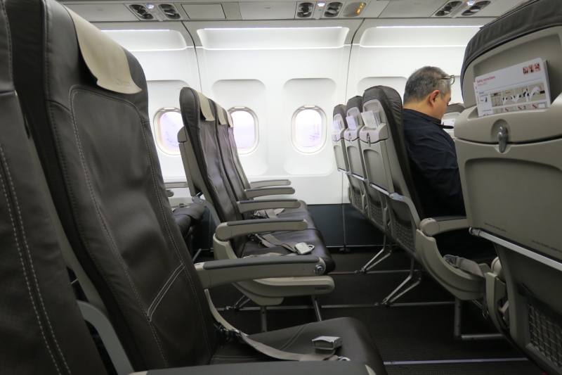 a man sitting in an airplane