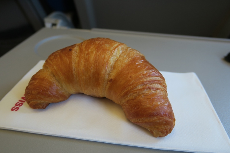 a croissant on a napkin