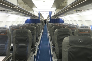 a plane with seats and a person in the back