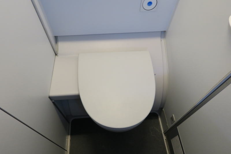 a toilet in a small bathroom