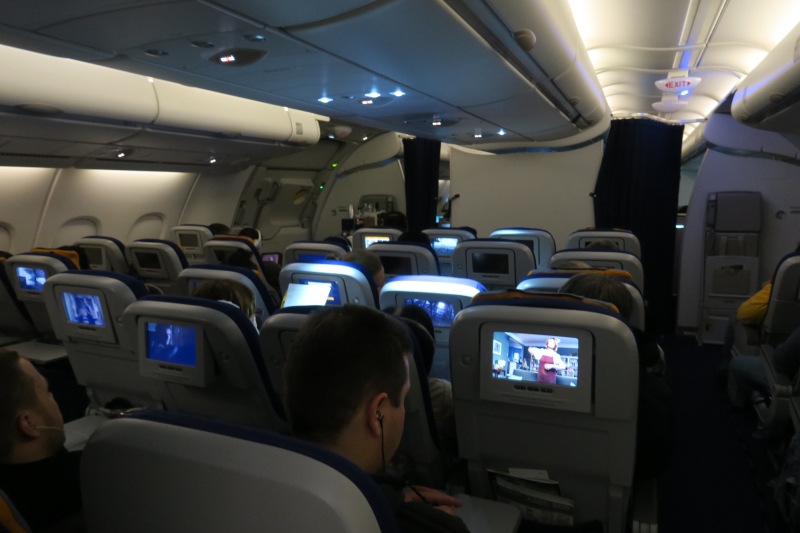 a group of people sitting in an airplane