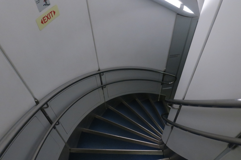 a spiral staircase with metal railings