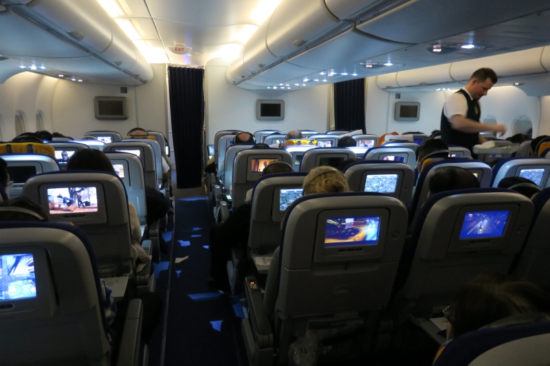 a group of people sitting in an airplane