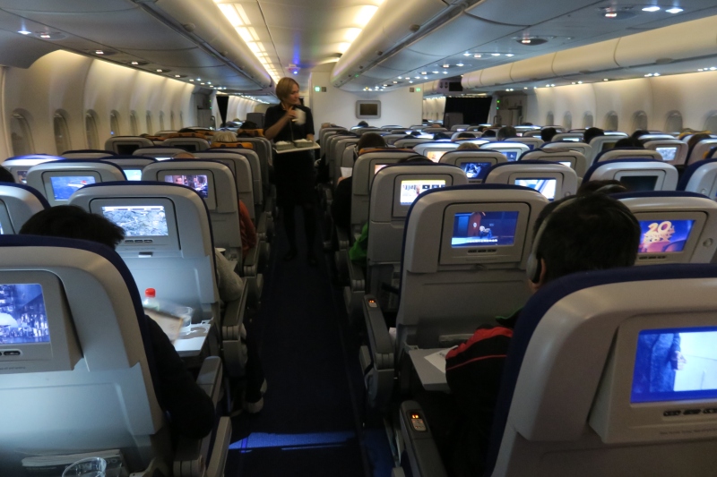 a group of people sitting in an airplane