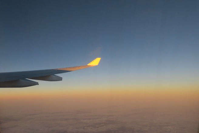 an airplane wing in the sky