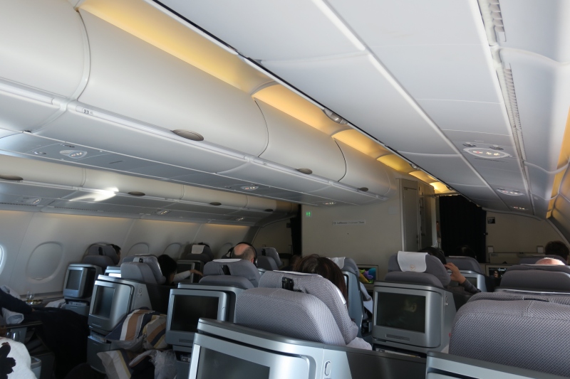 a group of people sitting in an airplane