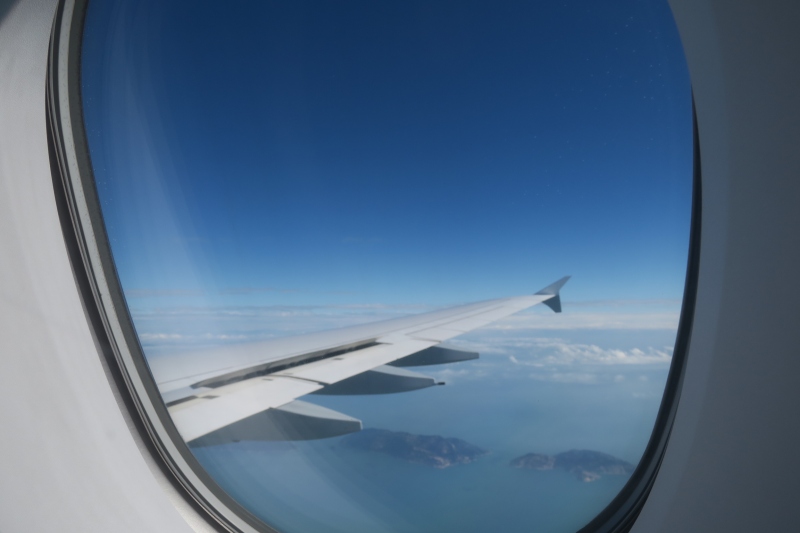 an airplane wing and sky