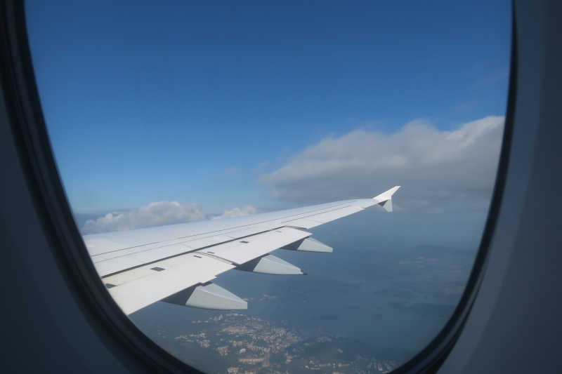 an airplane wing in the sky