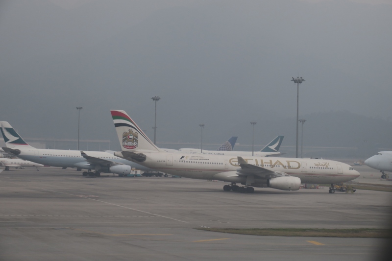 a group of airplanes on a runway