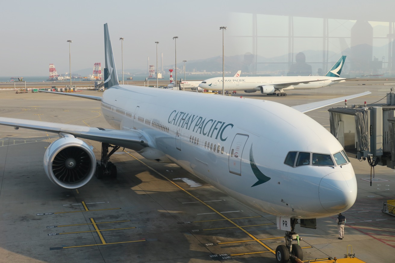 a large white airplane on a runway