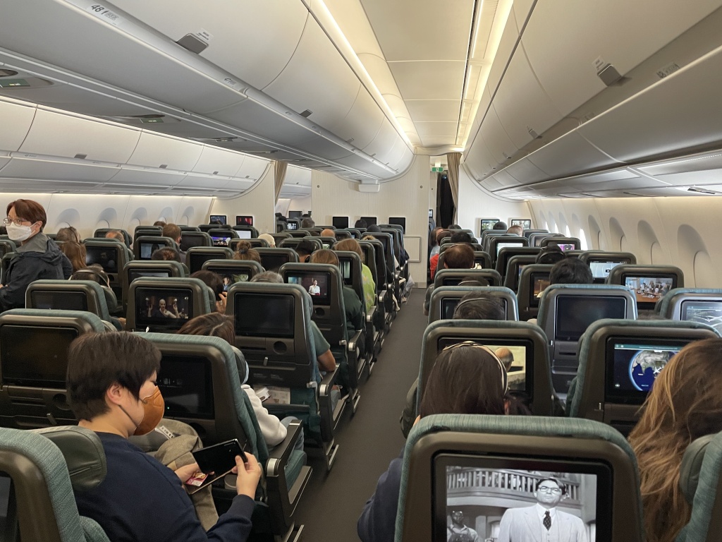 a group of people sitting in an airplane