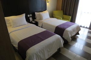 a hotel room with two beds