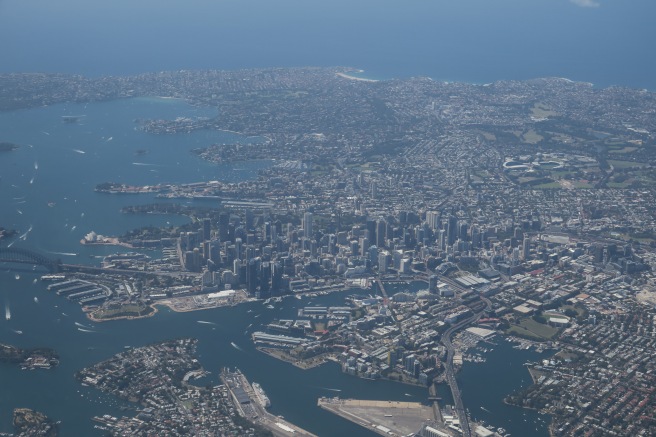 an aerial view of a city and water