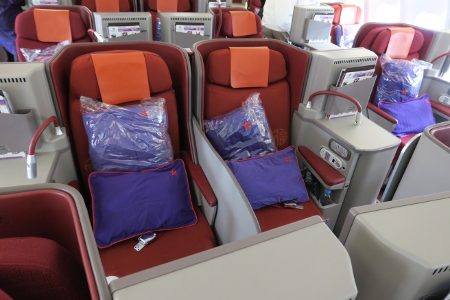 a row of seats with pillows